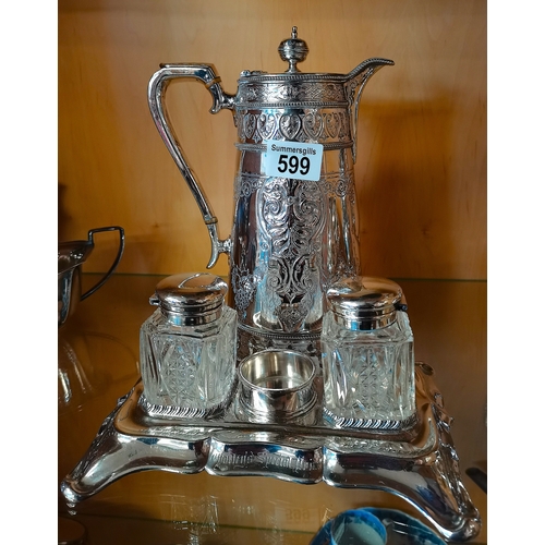 599 - Silver plated water jug with ornate dÛ_cor and plated ink well (Exc. Cond)