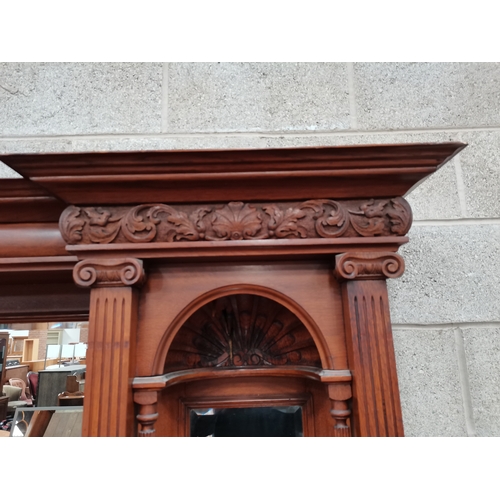 1046 - An Antique oak large Arts and Crafts style sideboard with mirror back and decorative panelling