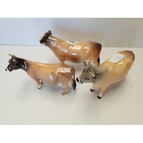 116 - 2 x Guernsey Beswick bulls and Guernsey cow (minor repairs to all 3)