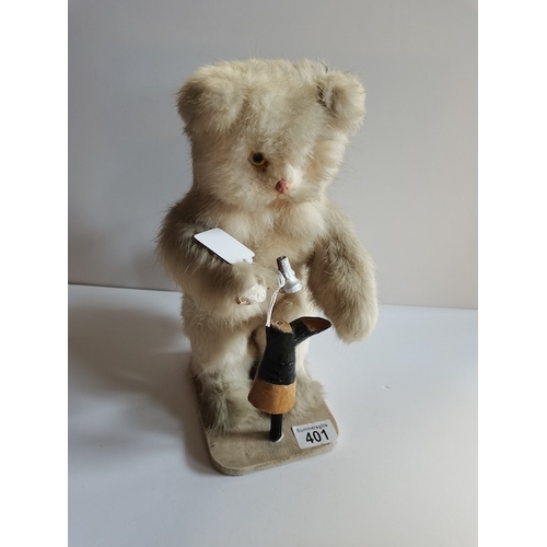 401 - Antique mechanical cat with glass eyes hitting a boot (in working order, little bit of fur missing o... 