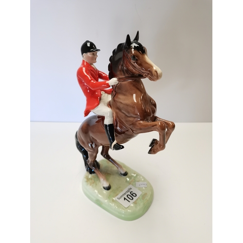 106 - Beswick huntsman rearing on brown horse