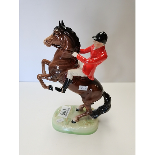 106 - Beswick huntsman rearing on brown horse