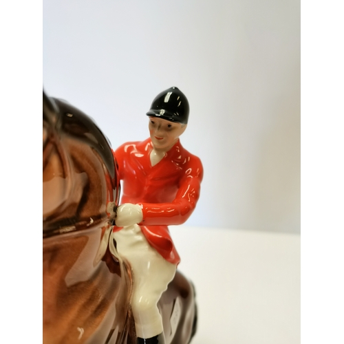 106 - Beswick huntsman rearing on brown horse