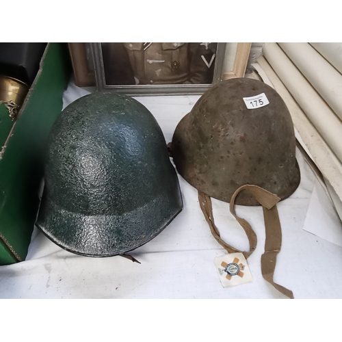 175 - 2 x possibly Italian helmets