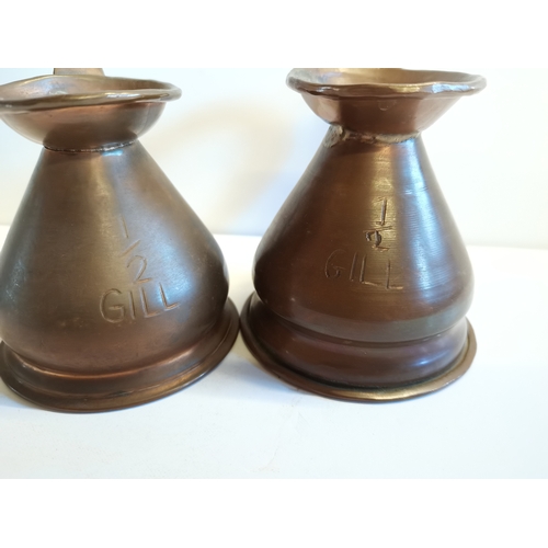 458 - 6 Copper measuring jugs with lead seals