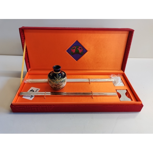 496 - 2 pairs boxed Shaghai Tang plated chopsticks and miniature vase