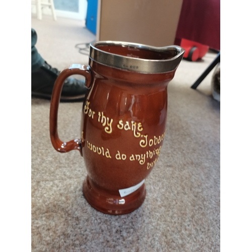 481 - Doulton tobacco jug with silver mount (some damage to base)