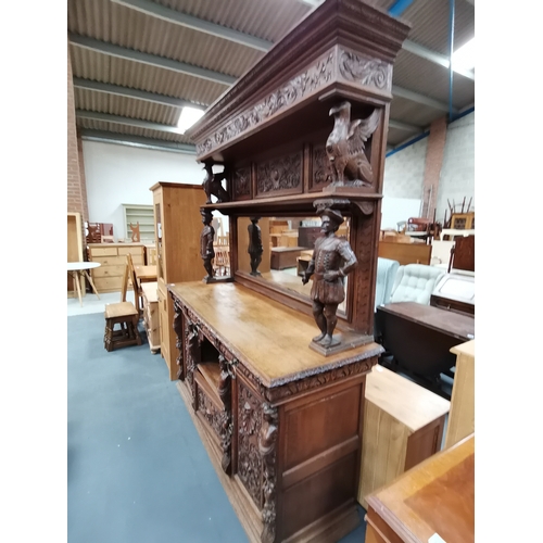 1147 - An Antique Large Heavily Carved Dutch Style sideboard with mirror back. Fabulous carved figurines.... 