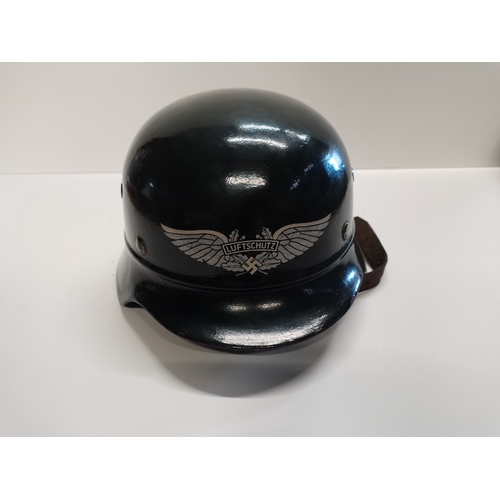 271a - Black WWII  German helmet with eagle motif