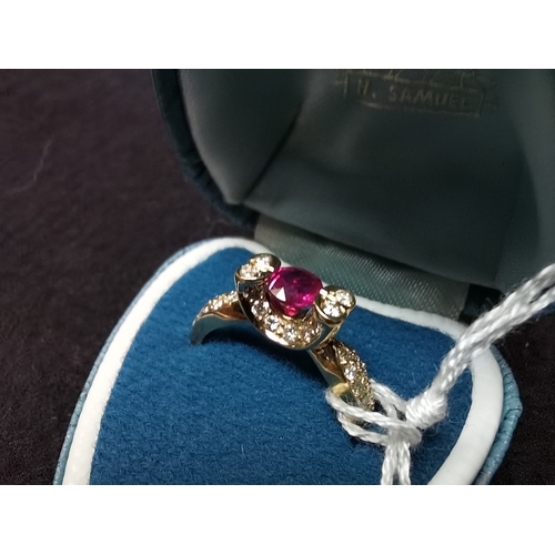 440c - 18ct 750 Gold desinger ring size P centre ruby stone with diamonds and diamond shoulders