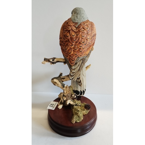 93 - A Figure of Bird on a Wooden Stand made by Sheart and simpson England 30cm