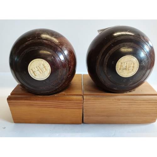 109 - 2 Wooden Balls 1914 Bowling Bowls on Stands