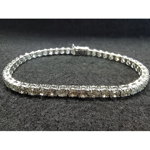 432 - A 45 stone diamond set tennis line bracelet on white gold total weight 10 cts colour L/M clarity SI ... 