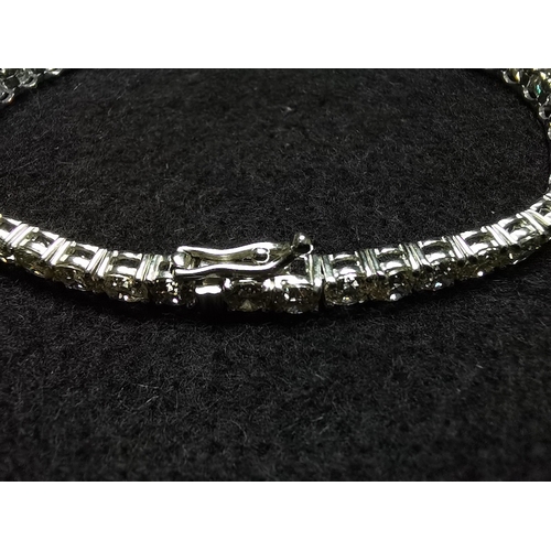 432 - A 45 stone diamond set tennis line bracelet on white gold total weight 10 cts colour L/M clarity SI ... 