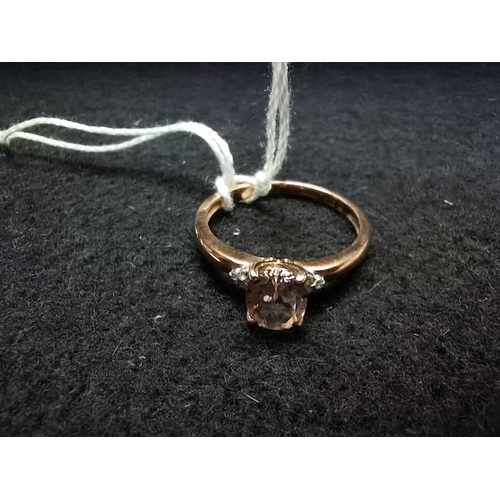 451 - 9ct rose gold ring oval center stone flanked by 2 white stones size Q