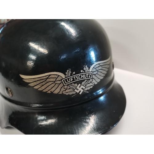 271a - Black WWII  German helmet with eagle motif