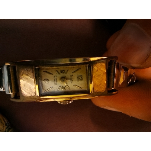 446l - 4 gold watches and 1 plated