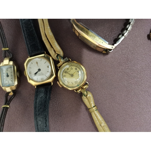 446l - 4 gold watches and 1 plated