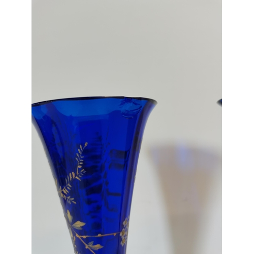 197 - Pair of hand-decorated blue Victorian vases (chip to one rim)