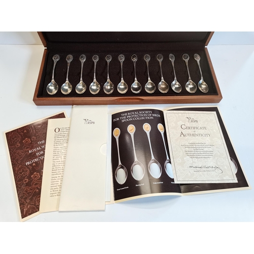 322 - 2 x sets of silver spoons The Royal Society of Birds and Flowers