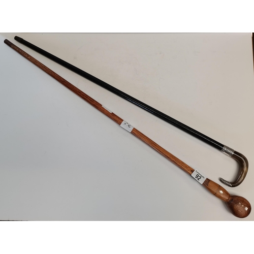 92 - x2 Walking sticks, (1) Tapered ebonised shaft with silver repousse mounts and horn handle. (2) Folk ... 