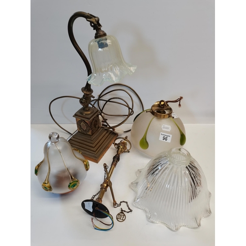 96 - A selections of brass lamps and glass shades