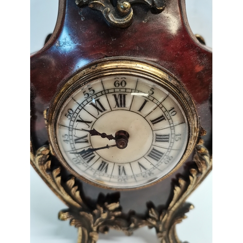 89 - Vintage design Baroque style counter clock in wood and  tortoiseshell veneer with gilded bronze legs