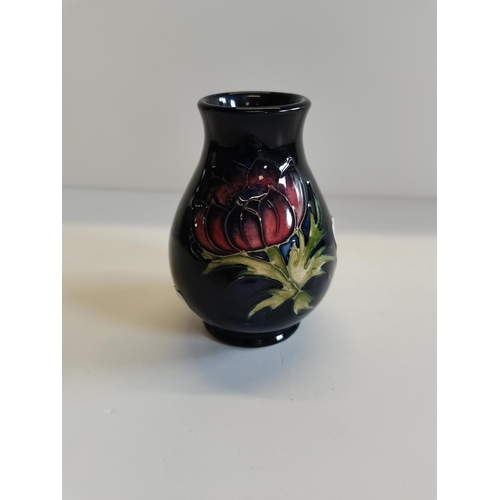 193 - Small Moorcroft 'Anemone' on blue vase H10cm - some crazing on inner base and inside of lid