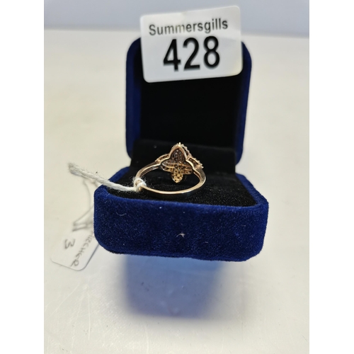 428 - Ring in flower design cluster ring set with black and blue diamonds (one stone missing) size P