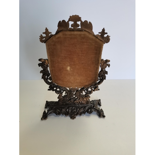 63 - Cast iron face mirror