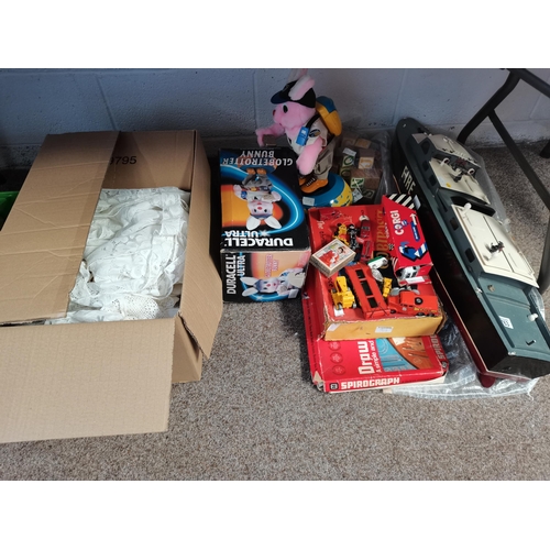 763 - Large Box of linen, Fire Boat, Duracell Globetrotter Bunny and assorted toys