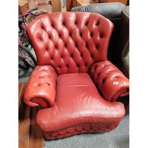 949 - Orange leather chesterfield armchair