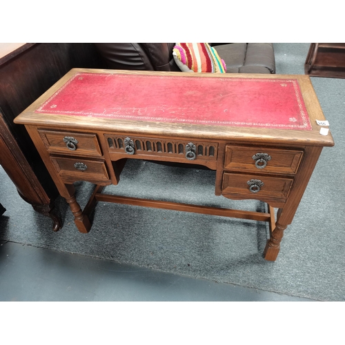 956 - Antique Red leather topped writing desk D48cm x W107cm x H72cm plus a large selection of books