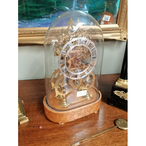 702a - Antique Skeleton Mantle clock on a birds eye maple stand. height 39cm ex condition.