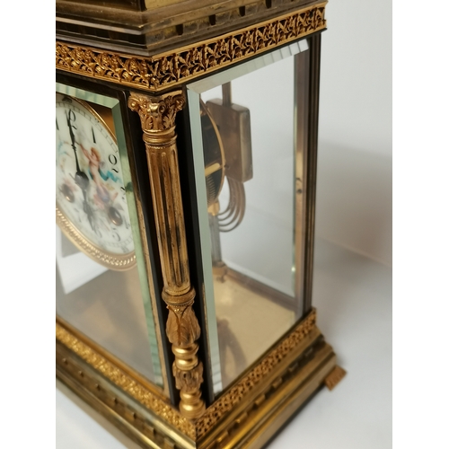 702c - Antique Gilt/brass Mantle Clock with porcelain cherub face decoration ex condition 25cm high x 17cm