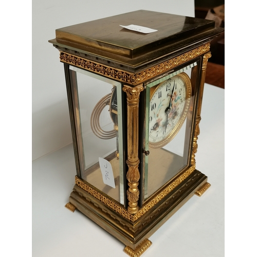 702c - Antique Gilt/brass Mantle Clock with porcelain cherub face decoration ex condition 25cm high x 17cm