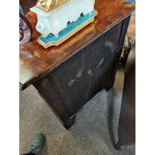 597 - Walnut and mahogany serpentine front bachelors chest having brush slide above four graduated drawers... 