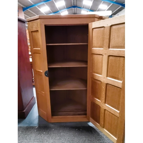 643o - Mouseman wall mounted corner cupboard. very good condition