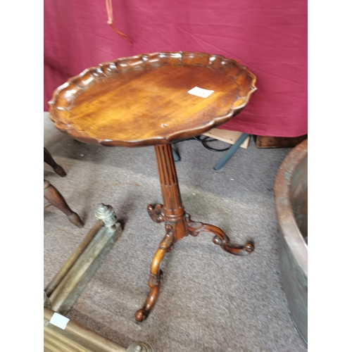 655 - A reproduction wine table, 36cm across 55cm tall