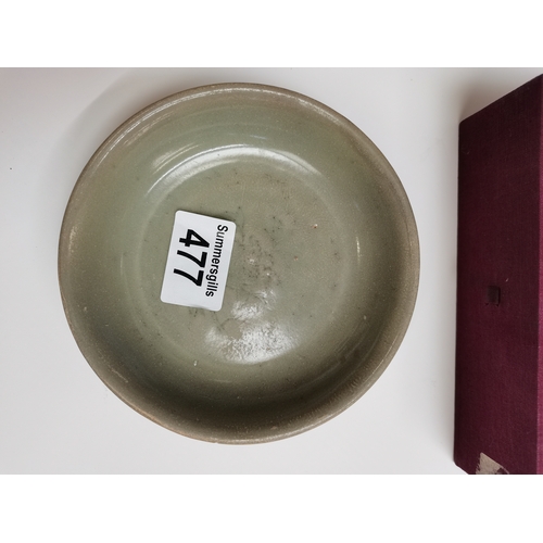 477 - A 14cm early olive coloured bowl in case excellent condition