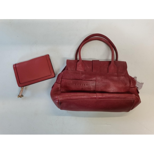 386 - Rust coloured Radley handbag with pink stitching and dust bag .  Matching purse.  Good condition but... 