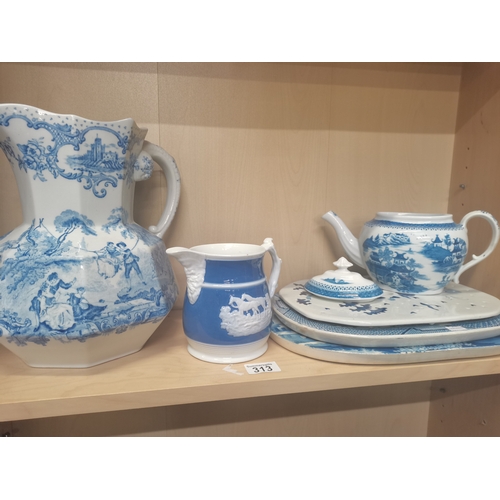 313 - Blue and White Jugs, drainers and teapot