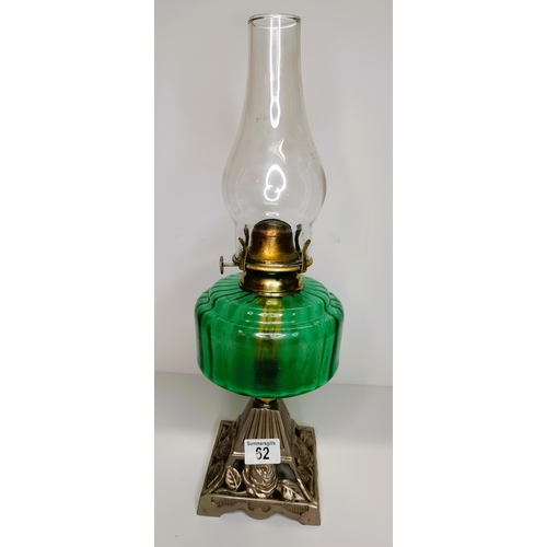 62 - Green glass oil lamp with metal base - good condition