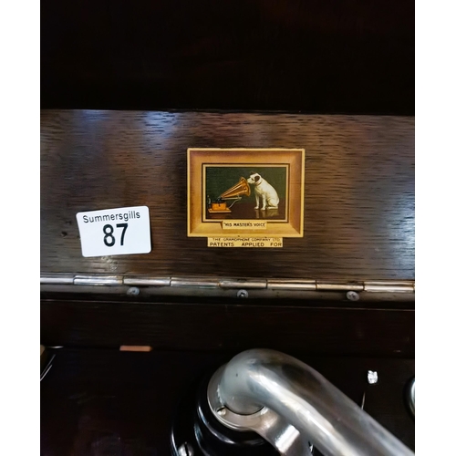 87 - Antique Oak Gramophone HMV model 106 with a selection of 78rpm records