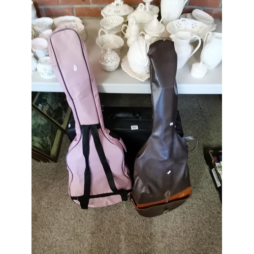 867 - 2 acoustic guitars and suitcase