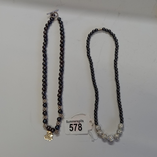 578 - x2 Black Pearl necklaces - good condition