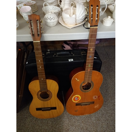 867 - 2 acoustic guitars and suitcase