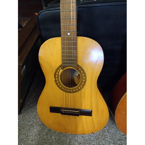 867 - 2 acoustic guitars and suitcase