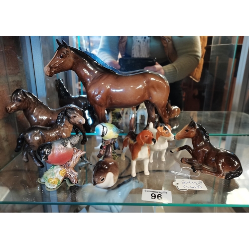 96 - A collection of Beswick Animals including horses, dogs and birds (one bird been repaired)