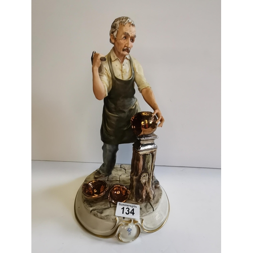 134 - A Capodimonte figure of a blacksmith - H30cm